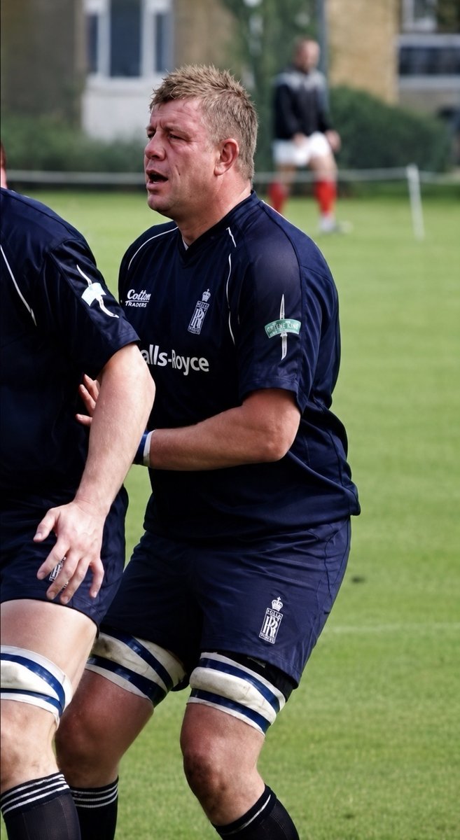 Paul Newman mid-match in the dark blue Royal Navy rugby kit.